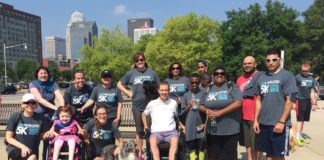 Todd Crawford, Center, with participants in the 5K to Cure Paralysis in 2015