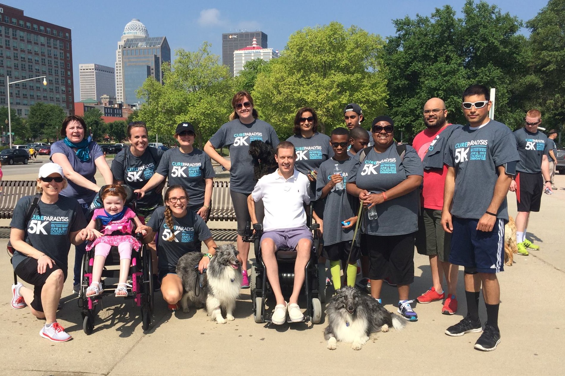 Todd Crawford, Center, with participants in the 5K to Cure Paralysis in 2015