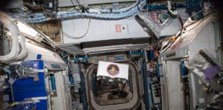An Anheuser-Busch CubeLab floating inside of the International Space Station after project completion.