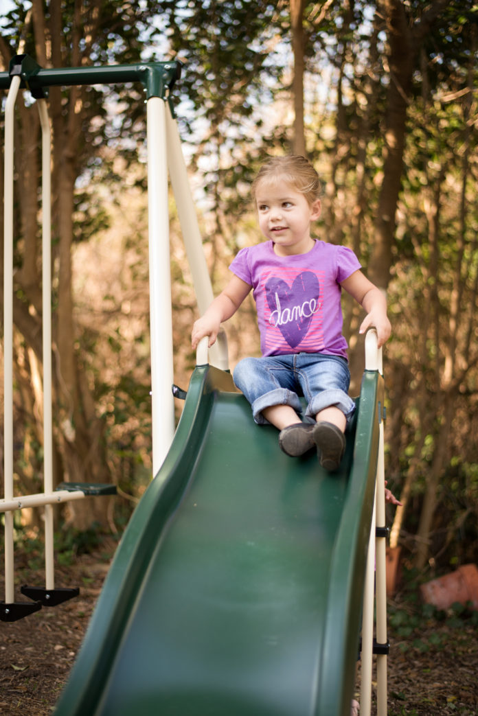 child on slide