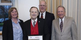 Larry Tyler, center, was recently recognized for 55 years of teaching in the Speed School.