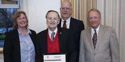 Larry Tyler, center, was recently recognized for 55 years of teaching in the Speed School.