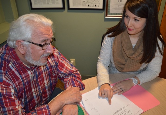 Older adult talking with behavioral health worker.