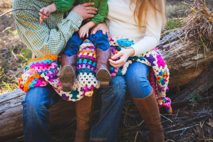 Parents holding a child