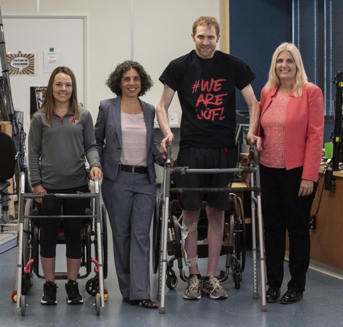 Left to right:  Kelly Thomas, Claudia Angeli, Ph.D., Jeff Marquis and Susan Harkema, Ph.D.