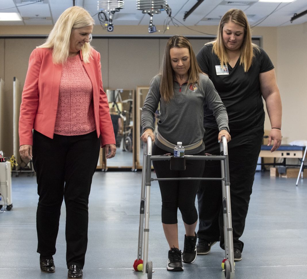 Susan Harkema, Ph.D., left, with research participant Kelly Thomas and Katie Pfost