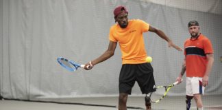 Dionte Foster, left, trains at the UofL Bass-Rudd Tennis Center on his new prosthetic leg.