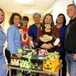 Family delivers Halloween baskets to UofL Hospital NICU.