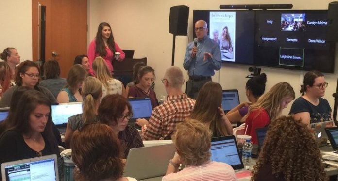 Joe D’Ambrosio instructs a group of students