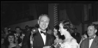 University of Louisville president John W. Taylor shakes hands with homecoming queen Debbie Blair after presenting her award for being chosen in 1949. Photo courtesy of University Libraries Digital Collections.