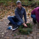 Student Nick Bremer shows off his holiday wreath.