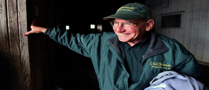 Micheal Blowen founder of Old Friends, a retirement facility for thoroughbred horses, waits for his friend, jockey Chris McCarron at his riding academy in Lexington, Ky. Photo by Stan Rosenfeld