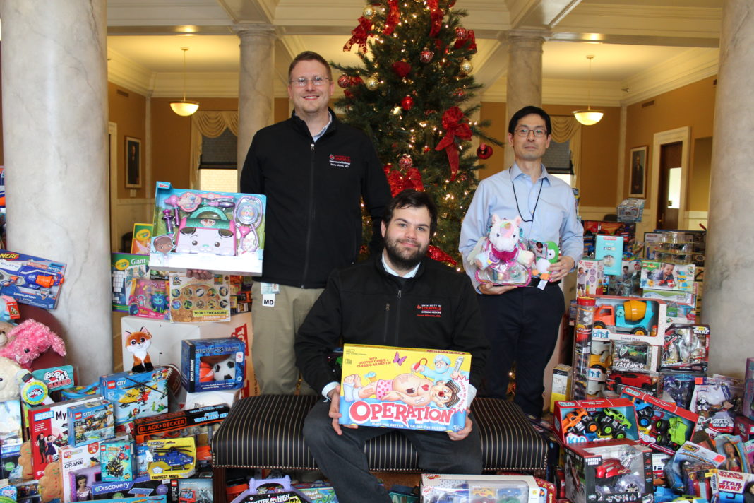 The UofL House Staff Council collected 870 gifts during its Toys for Tots campaign this month. Resident physicians pictured are (from left) Jamie Morris, M.D., Jared Winston, M.D., and Taro Muso, M.D.