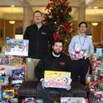 The UofL House Staff Council collected 870 gifts during its Toys for Tots campaign this month. Resident physicians pictured are (from left) Jamie Morris, M.D., Jared Winston, M.D., and Taro Muso, M.D.