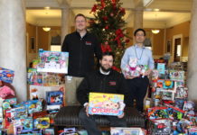 The UofL House Staff Council collected 870 gifts during its Toys for Tots campaign this month. Resident physicians pictured are (from left) Jamie Morris, M.D., Jared Winston, M.D., and Taro Muso, M.D.