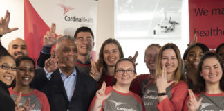 Launch associates throw up the "L" at the unveiling of Cardinal Health's new on-campus center.