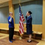 Andrew Aschbacher, doctor of nursing practice student at UofL, is commissioned into the Air Force by Maj. Angela Washington, a School of Nursing faculty member.