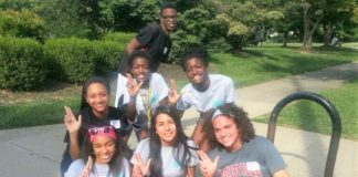 MLK Scholars at a community service event at Iroquois Park. Back row standing: Nuri Thompson. Middle row: Erica Gaither, Noela Botaka, Manuela Botaka. Front row: Taylor Hinna Williams, Elizabeth Peña, Elijah Ervin.