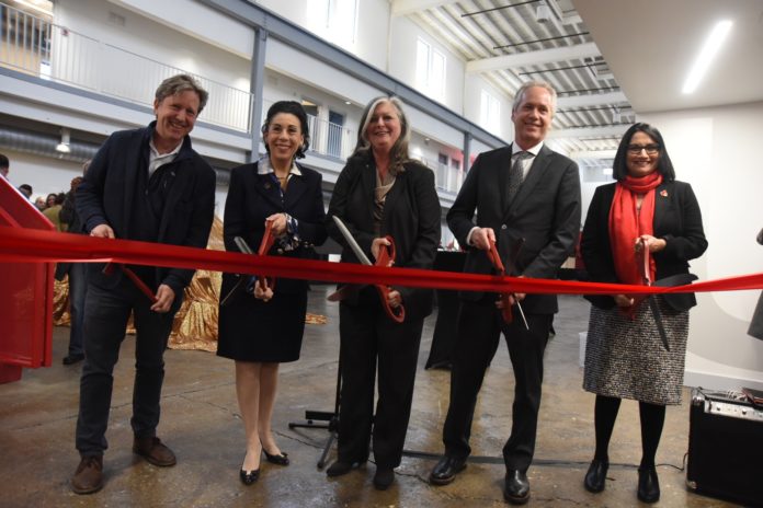 Gill Holland, Metro Councilwoman Barbara Sexton Smith, Dean Kimberly Kempf-Leonard, Mayor Greg Fischer and President Neeli Bendapudi prepare to cut the ribbon for renovated Portland space.