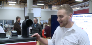 Mechanical engineering student Tyler Lampart presents his cooler-air conditioner prototype during Capstone showcase.