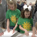 Young, future scientists play with a snow-like substance called sodium polyacrylate.