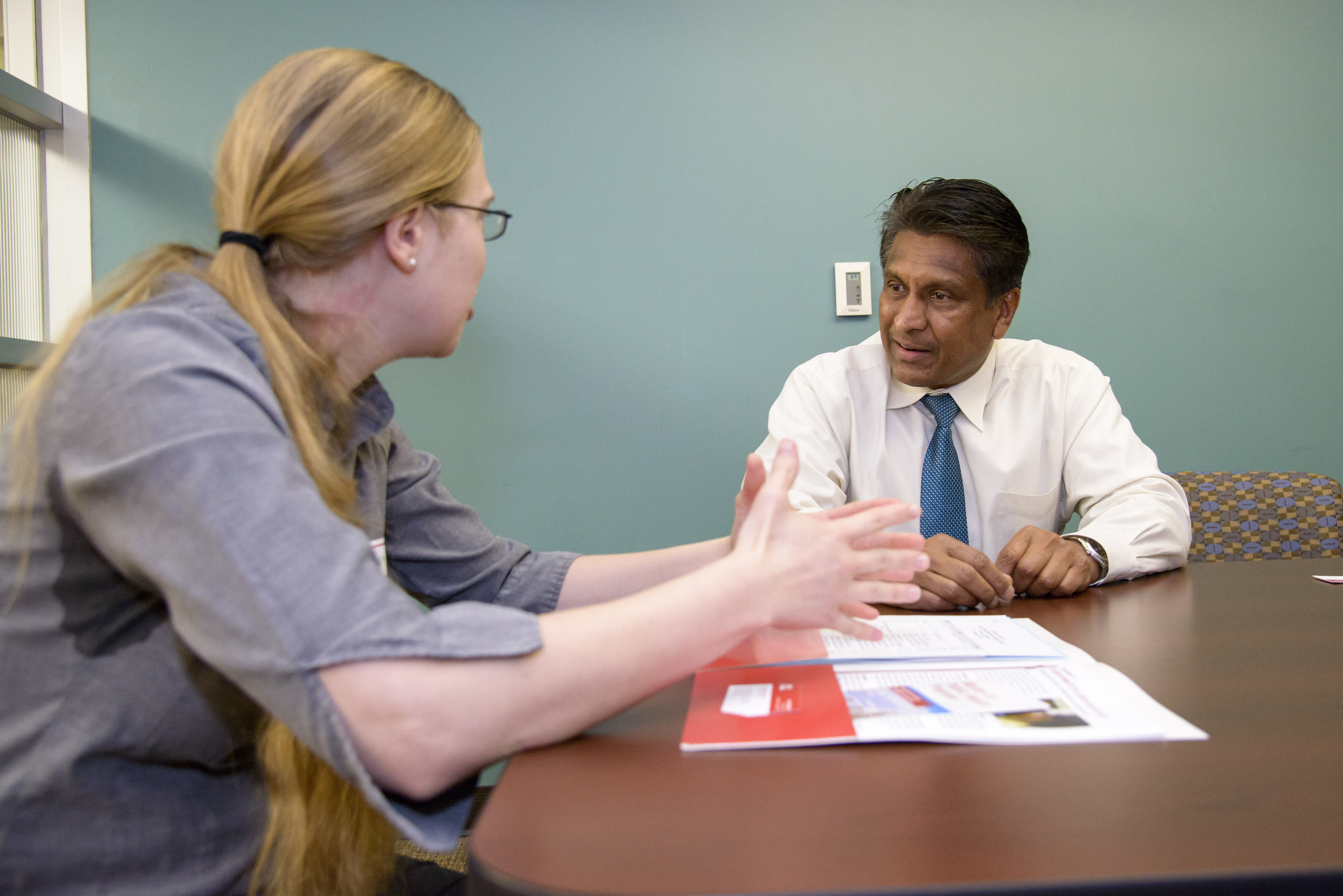 K.B. Kulasekera, Ph.D., talks with a student