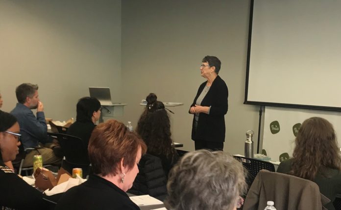 Mona Huff, community organizer, presents at an event