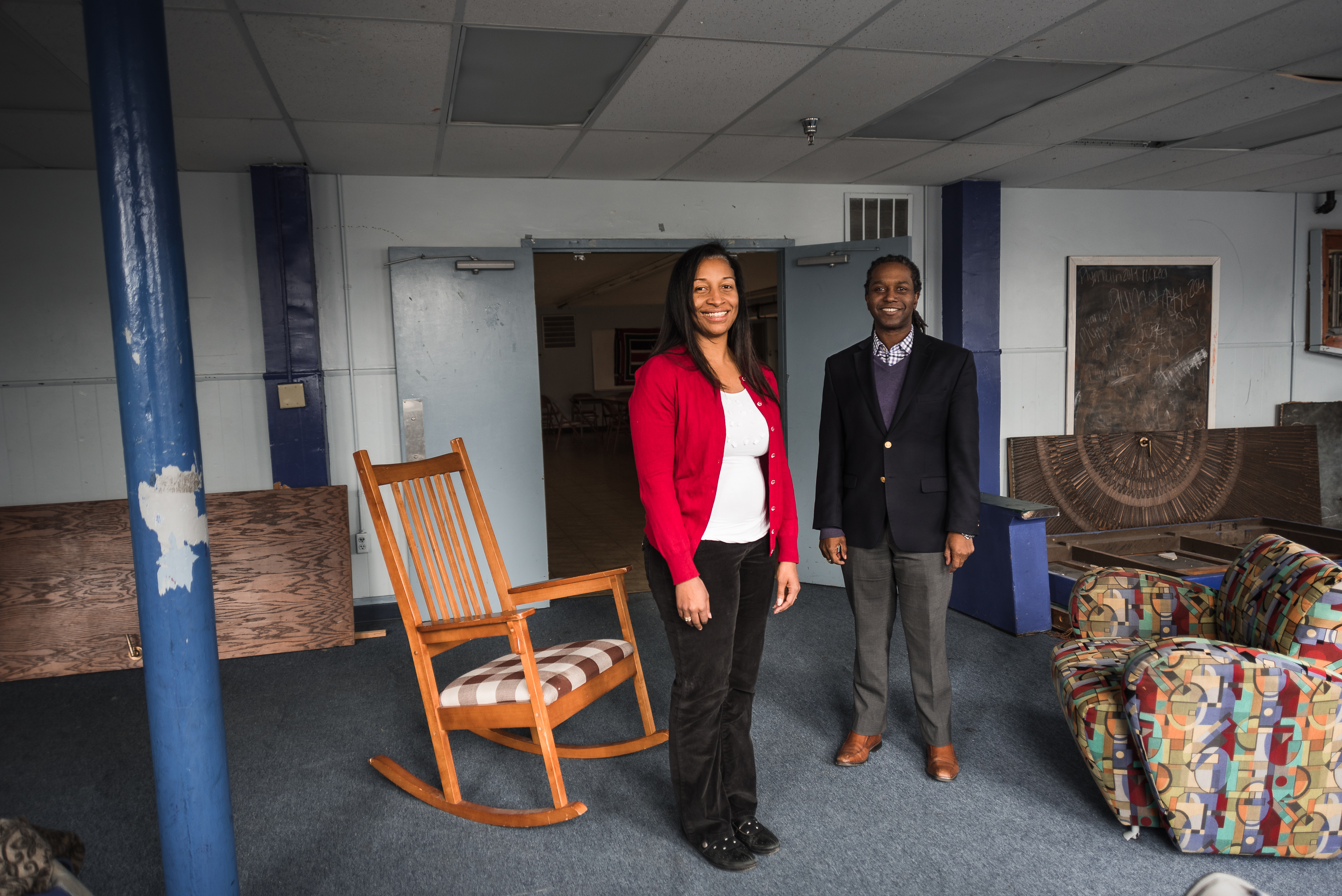 Kent School faculty Emma Sterrett-Hong and Maurice Gattis stand in a room of the soon-to-be opened Sweet Evening Breeze homeless shelter for LGBT youth.