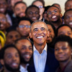 Former President Barack Obama poses for picture with Quintez Brown and MBK Rising participants in Oakland, California.