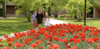 Becca Kemp and her two children on campus.