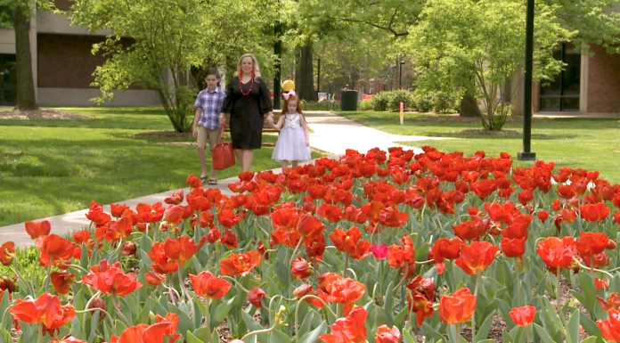 Becca Kemp and her two children on campus.