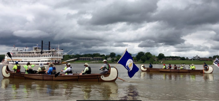 River City Paddlesports crews and volunteers arrive in Louisville June 9 at the end of their nine-day voyageur canoe and camping trip from Portsmouth, Ohio. The Afloat event was part of an effort to establish an Ohio River Recreational Trail.