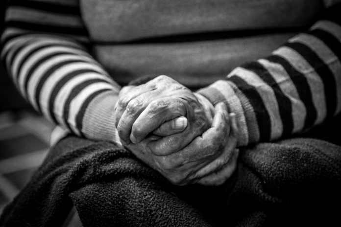 older adult hands Older adult with hands folded