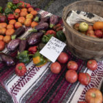 fruits and vegetables on a table at a farmers market