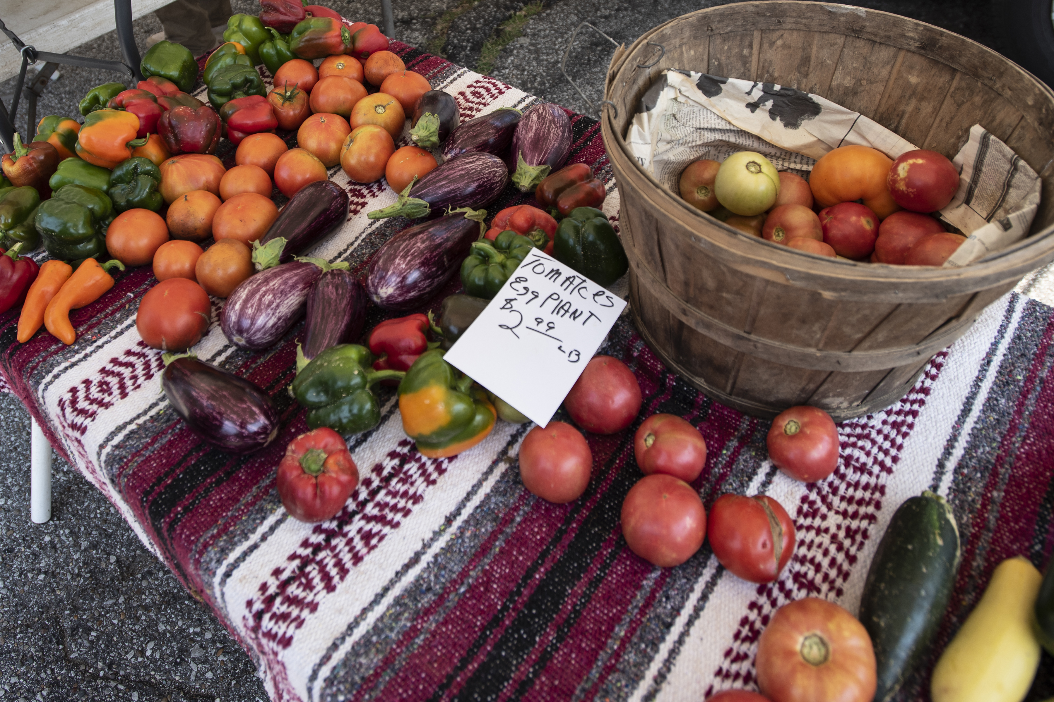 fruits and vegetables on a table at a farmers market