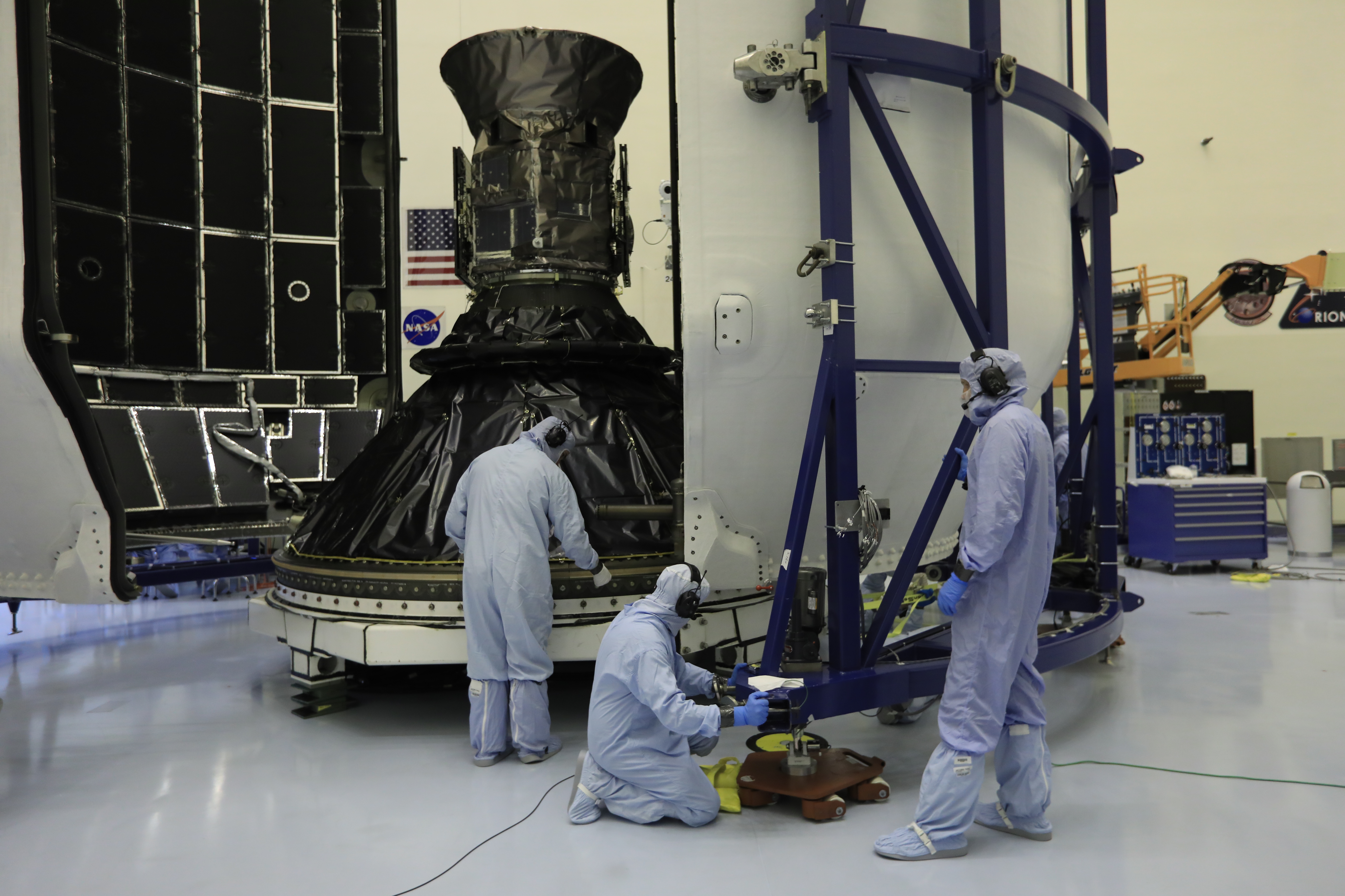 Technicians prepare NASA's Transiting Exoplanet Survey Satellite (TESS) for encapsulation in the SpaceX payload fairing inside the Payload Hazardous Servicing Facility at the agency's Kennedy Space Center in Florida.