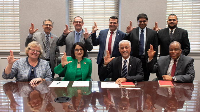 UofL administrators, including President Neeli Bendapudi, and University of Dubai administrators, including President Eesa Bastaki.