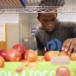 Bryant Grant, student volunteer at the Cardinal Cupboard.