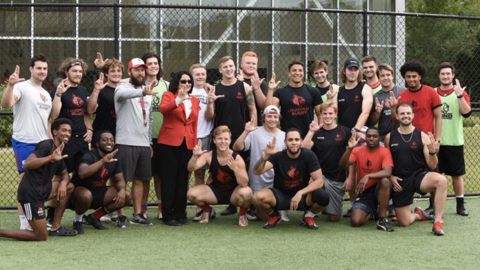 The UofL Rugby Team poses with President Neeli Bendapudi