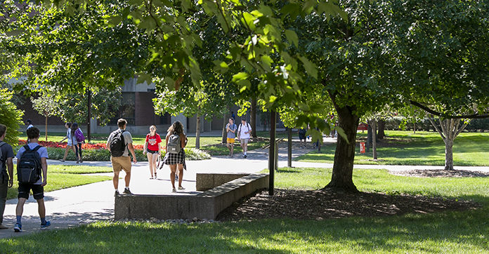 Students walking around campus during the fall.