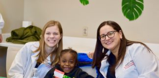 The Shop with a Dentist program pairs UofL dental students with underserved elementary students.