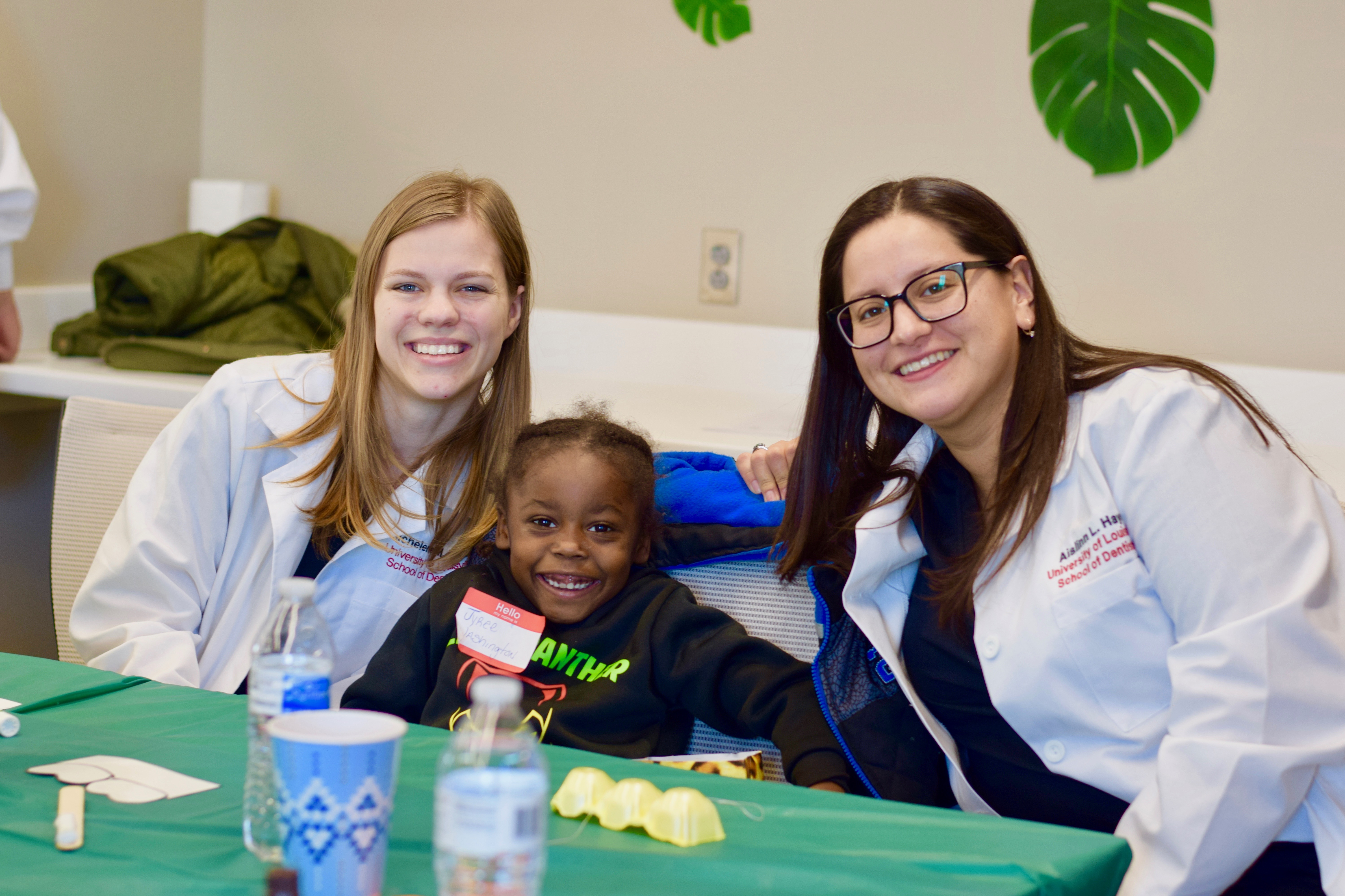 The Shop with a Dentist program pairs UofL dental students with underserved elementary students.