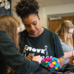 Lewis works on her designs in UofL's studio.