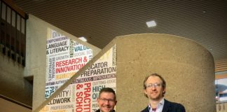 UofL researcher Brad Shuck (left) and entrepreneur Charley Miller (right) in the CEHD atrium