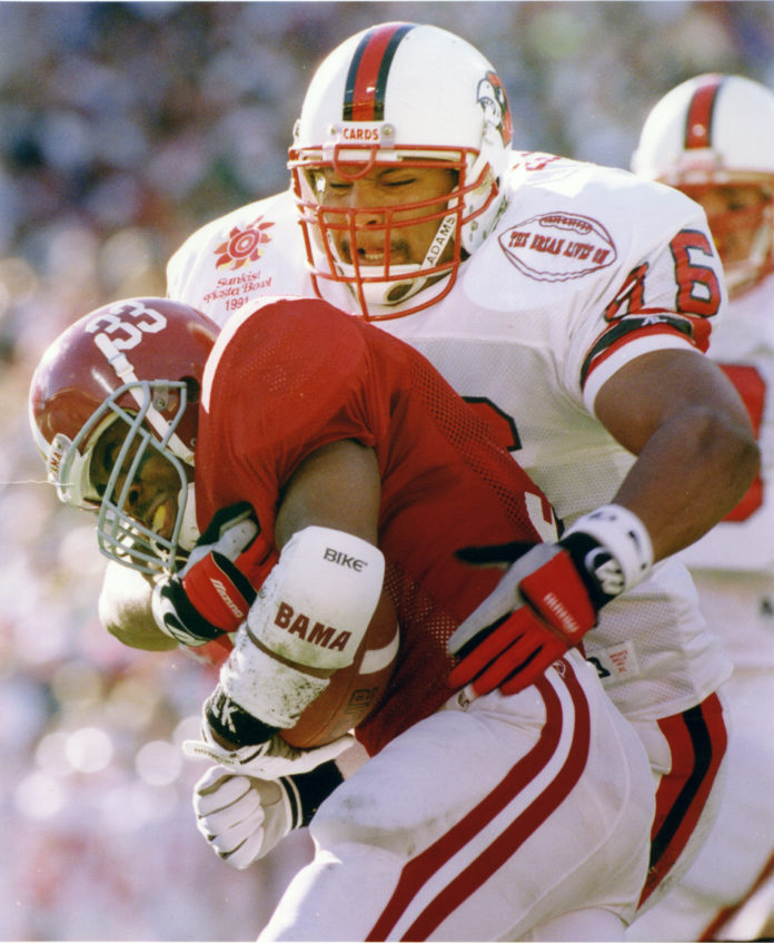 flores UofL players wore a patch during the 1991 Fiesta Bowl game that read,” The Dream Lives On,” in response to Arizona voters' rejection of making that a recognized holiday months prior.