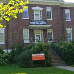 A Black Lives Banner hangs on the Kent School of Social Work building.