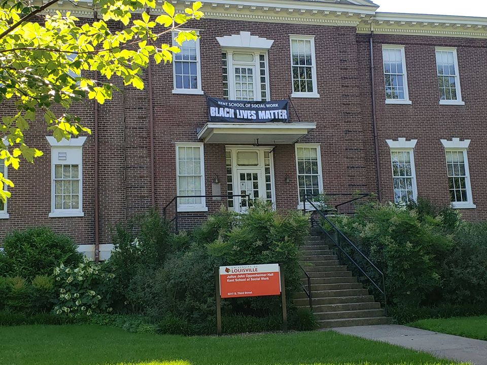 A Black Lives Banner hangs on the Kent School of Social Work building.