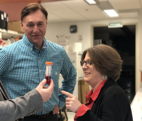 Qualigen CEO Michael Poirier and UofL's Paula Bates