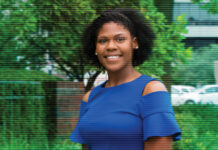 Keionna Bailey, standing in front of greenery