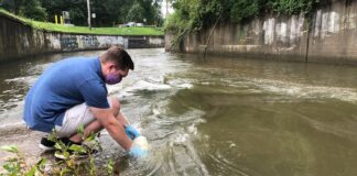 UofL student Sam Kessler using the water testing tool